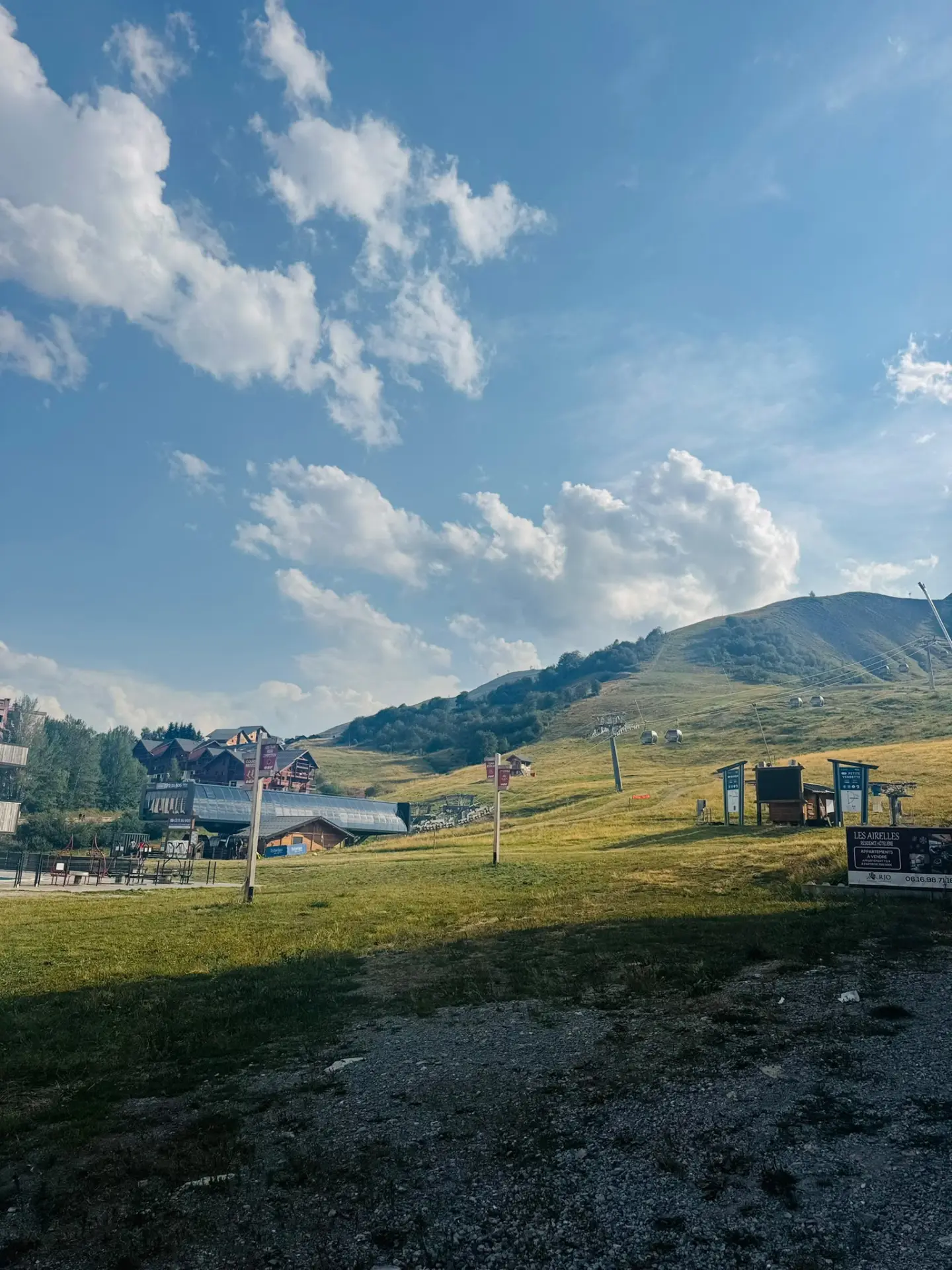 Sunlit mountain meadow and chalets in the South of France