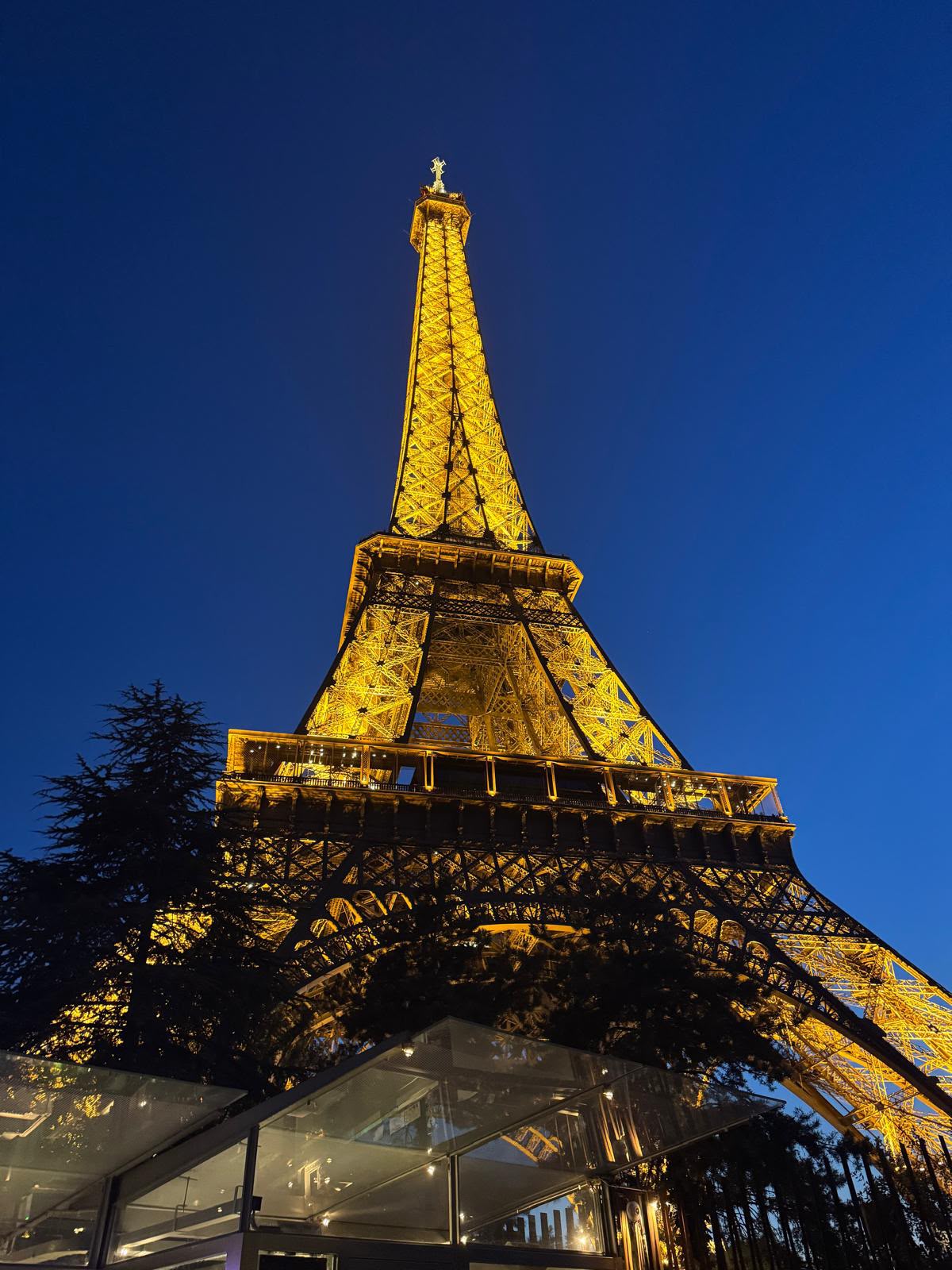 Eiffel Tower illuminated at dusk in Paris